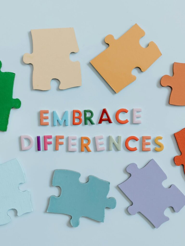 Colorful Puzzle Pieces and a Text Saying "Embrace Differences"